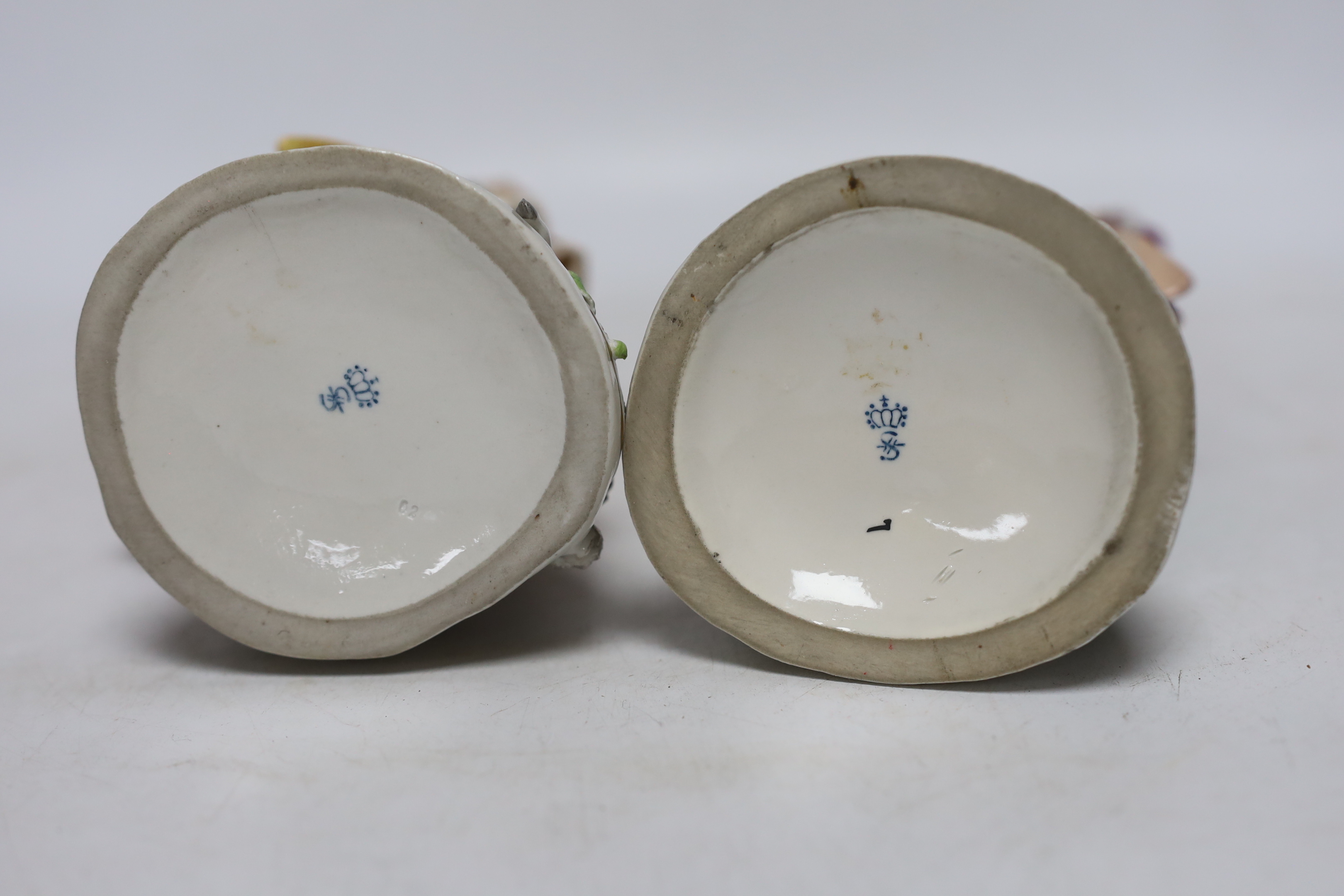 Four Sitzendorf porcelain figures in groups, early 20th century, 26cm
